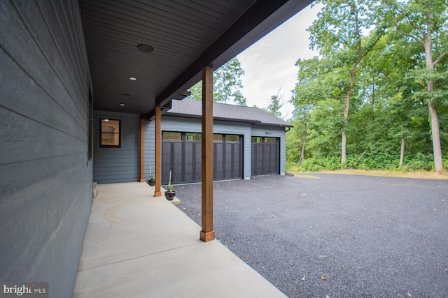 view of patio / terrace featuring a garage