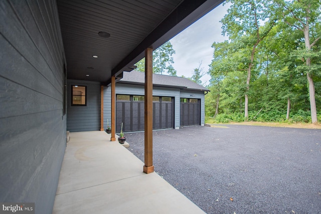 view of patio / terrace featuring a garage