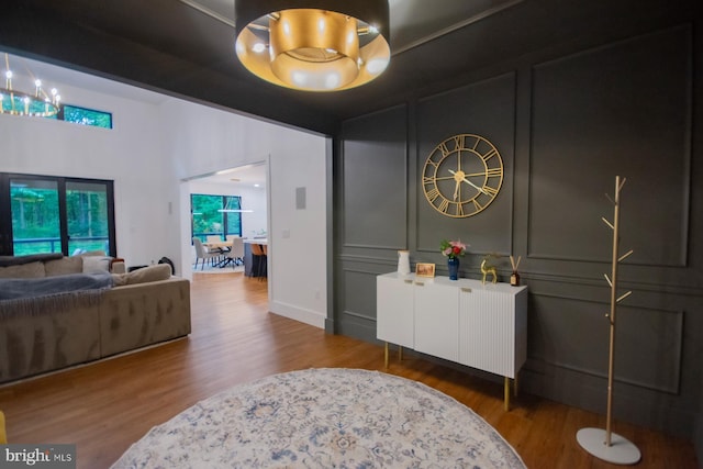 interior space featuring wood finished floors and a decorative wall