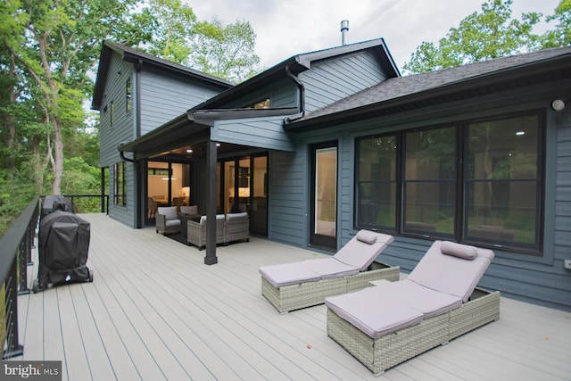 deck featuring an outdoor hangout area and a grill