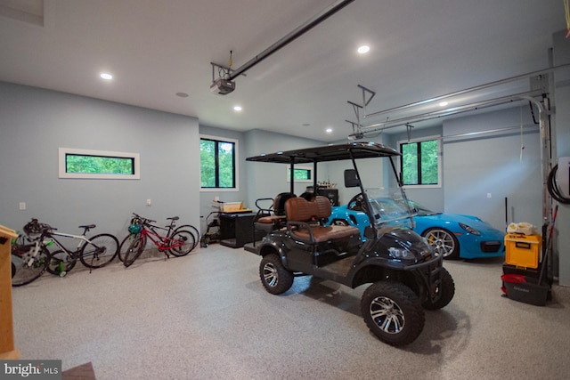 garage featuring recessed lighting and a garage door opener