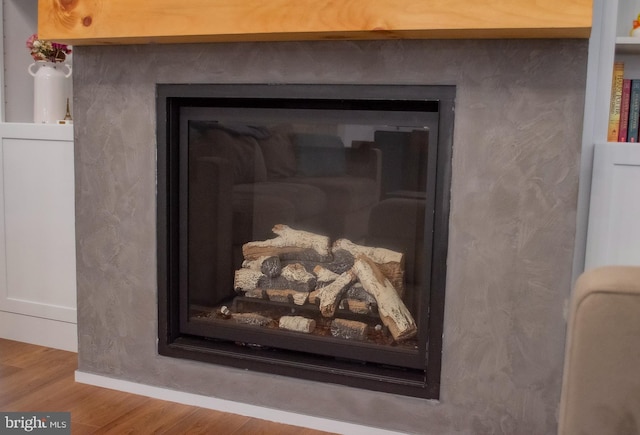 interior details with wood finished floors and baseboards