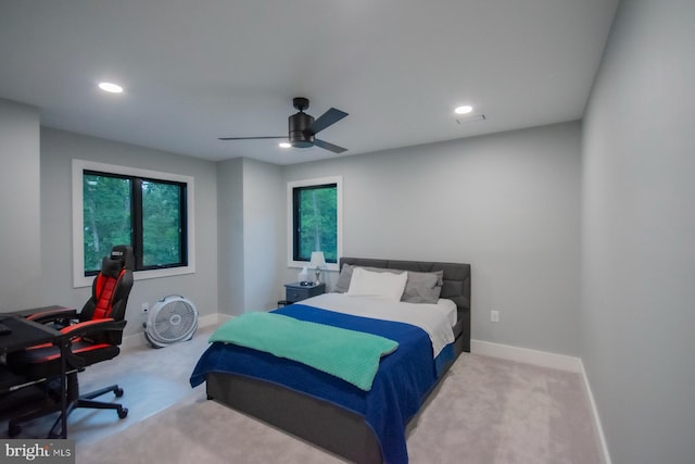 carpeted bedroom with a ceiling fan, recessed lighting, and baseboards