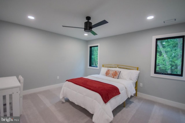 bedroom with baseboards, recessed lighting, a ceiling fan, and light colored carpet