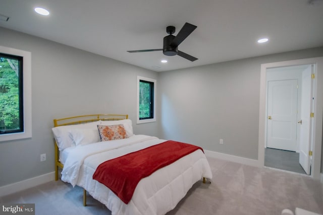 carpeted bedroom featuring baseboards, visible vents, a ceiling fan, and recessed lighting