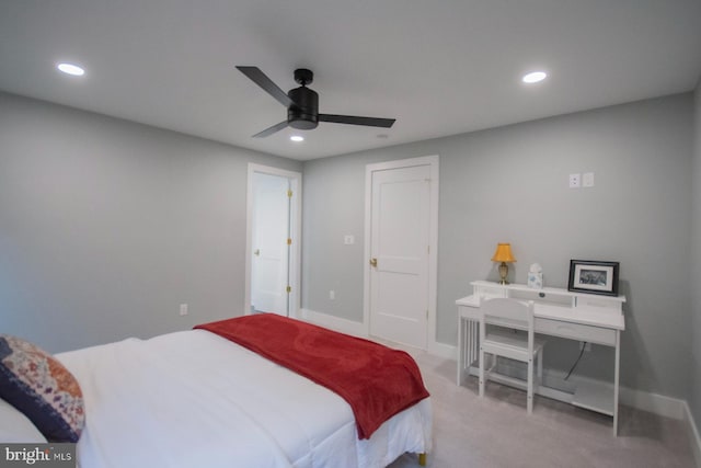 bedroom featuring a ceiling fan, recessed lighting, light colored carpet, and baseboards