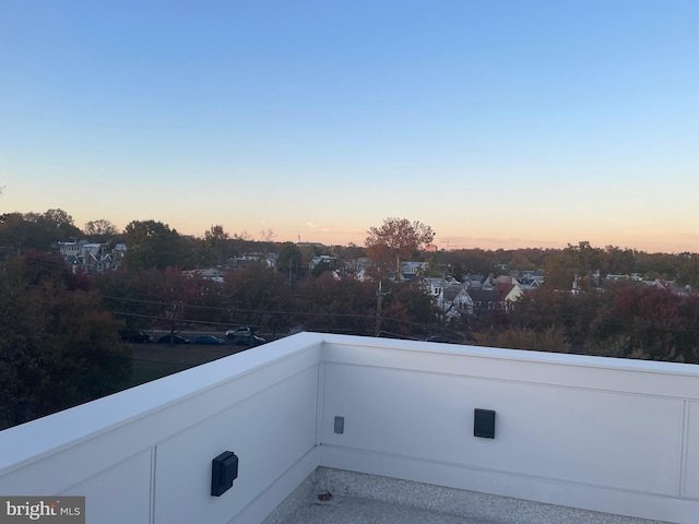 view of balcony at dusk