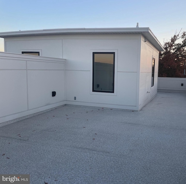 view of property exterior with a patio