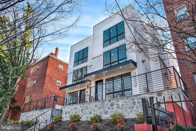 view of building exterior featuring fence