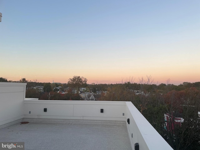 view of balcony at dusk