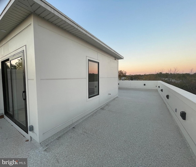 view of property exterior with a patio