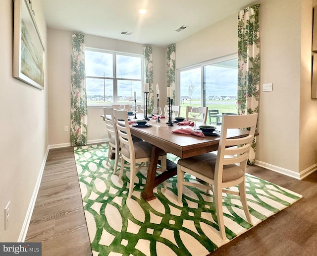 dining space with light wood-type flooring