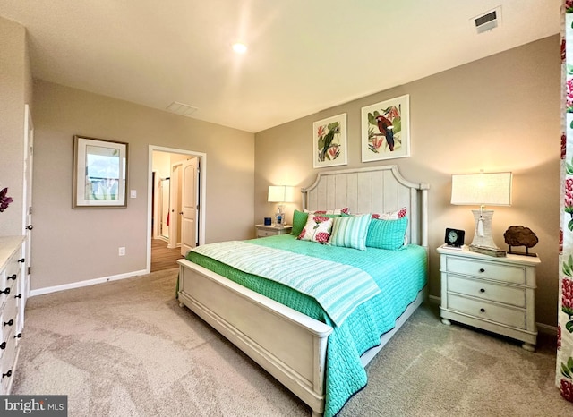 bedroom featuring light colored carpet