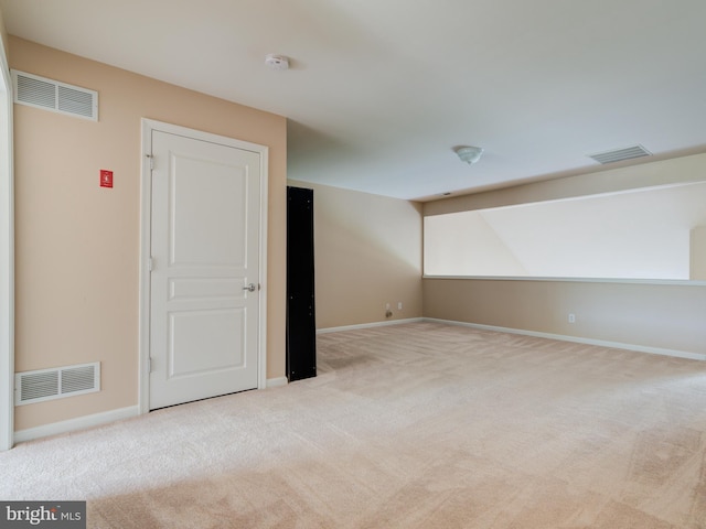 empty room featuring light colored carpet