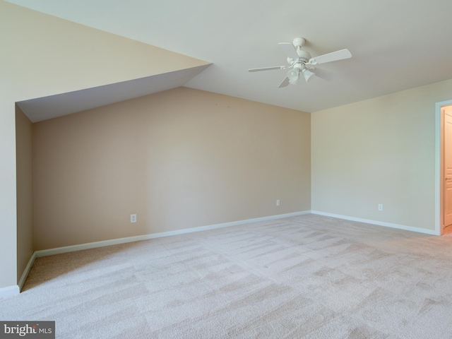 unfurnished room with ceiling fan and light colored carpet