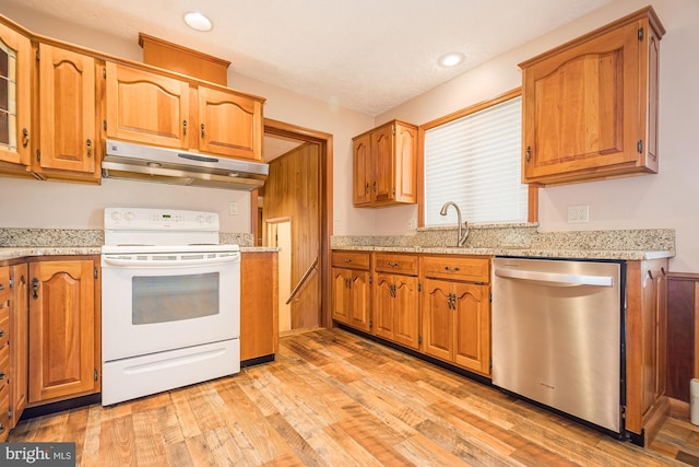 kitchen featuring light hardwood / wood-style floors, white electric stove, dishwasher, and sink