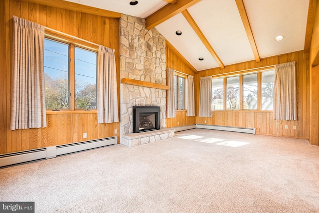 unfurnished living room featuring carpet floors, lofted ceiling with beams, a fireplace, and wooden walls