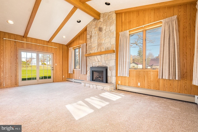 unfurnished living room featuring baseboard heating, carpet floors, vaulted ceiling with beams, wooden walls, and a fireplace