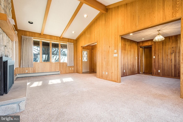 unfurnished living room featuring wood walls, baseboard heating, lofted ceiling with beams, and carpet flooring