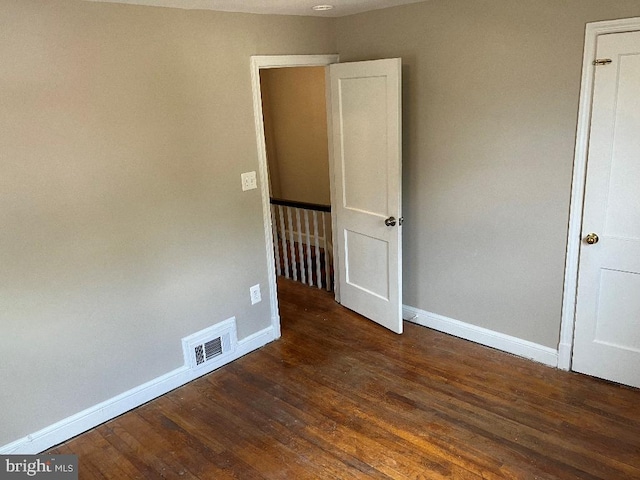 interior space with dark hardwood / wood-style floors