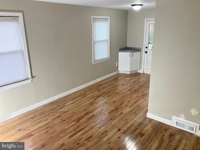 spare room featuring hardwood / wood-style floors