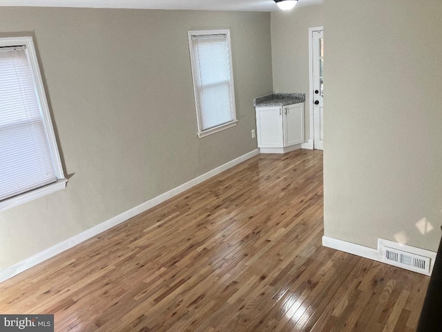 empty room featuring hardwood / wood-style floors