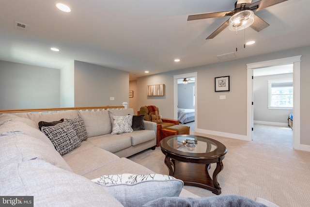 living room featuring ceiling fan and light carpet