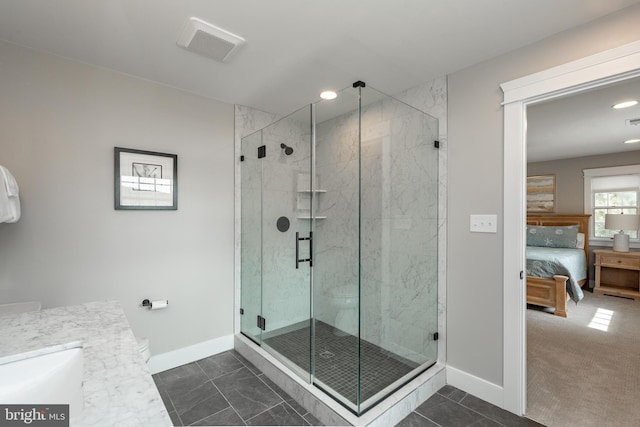 bathroom featuring walk in shower, tile patterned floors, and vanity