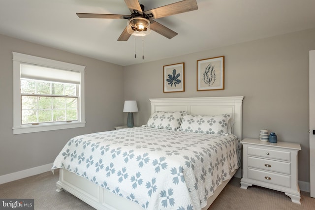 bedroom featuring ceiling fan and light colored carpet