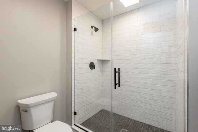 bathroom with toilet and walk in shower