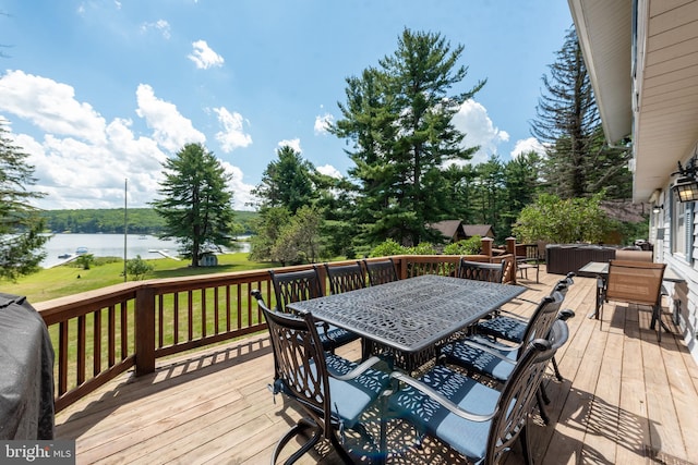 wooden deck featuring a water view