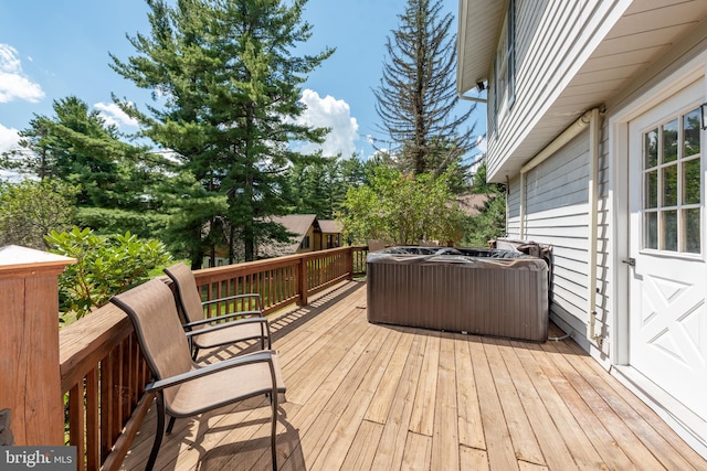 deck featuring a hot tub