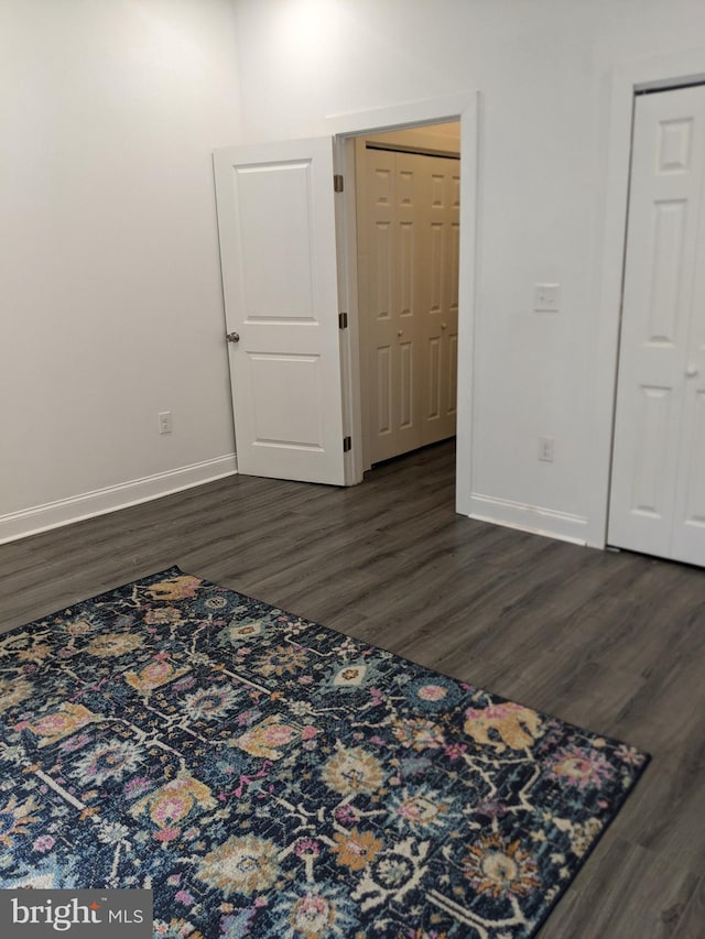 interior space with dark wood-type flooring