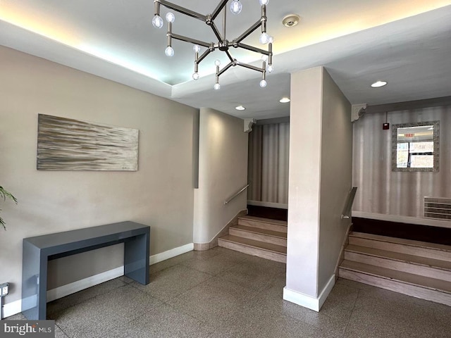 staircase featuring an inviting chandelier