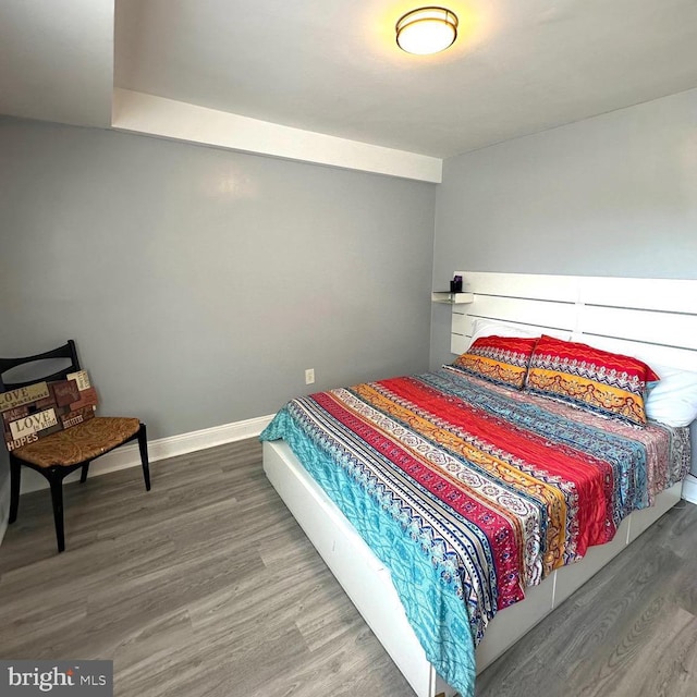 bedroom with hardwood / wood-style floors