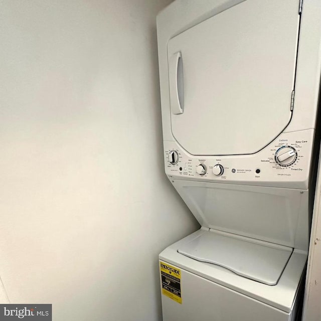 laundry room featuring stacked washer and dryer