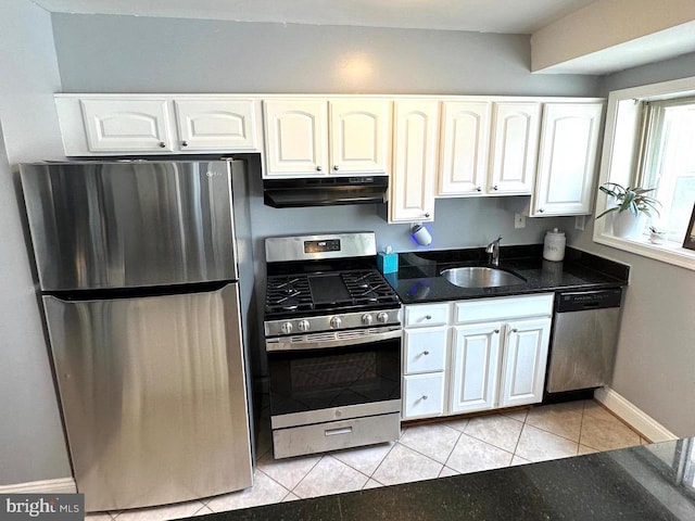 kitchen featuring white cabinets, light tile patterned flooring, sink, and stainless steel appliances