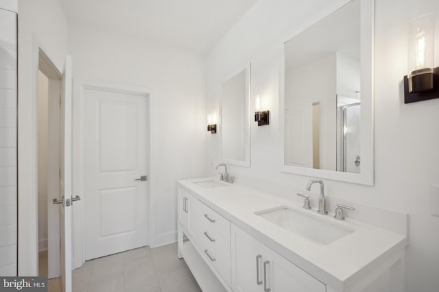 bathroom featuring vanity, tile patterned floors, and walk in shower