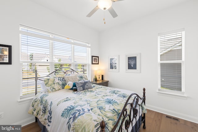 bedroom featuring hardwood / wood-style floors and ceiling fan