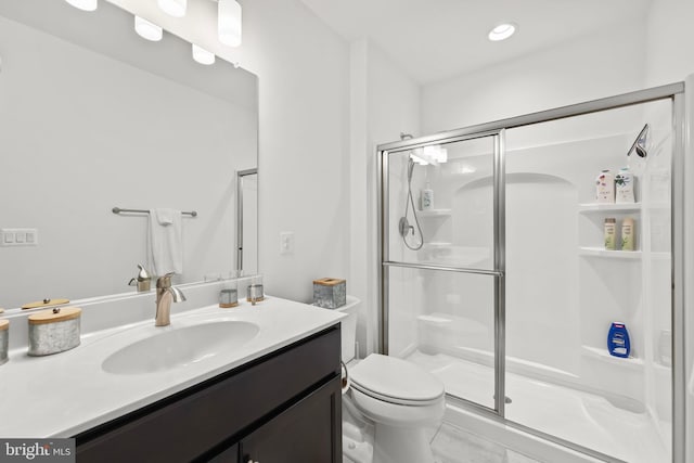 bathroom with vanity, an enclosed shower, tile patterned flooring, and toilet