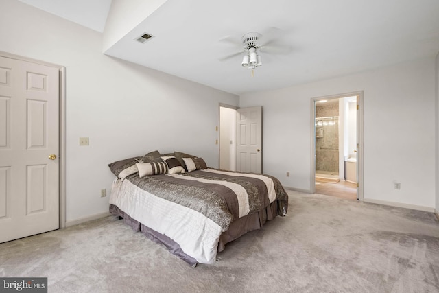 bedroom featuring connected bathroom, carpet, and ceiling fan