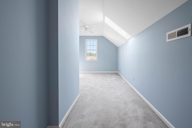 additional living space with carpet flooring, vaulted ceiling, and ceiling fan