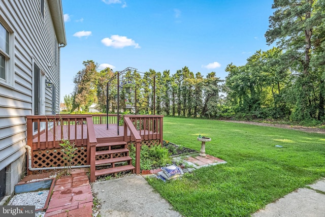 view of yard with a wooden deck