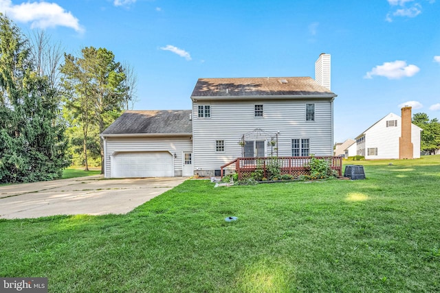 view of front of property with a deck, a garage, central air condition unit, and a front lawn