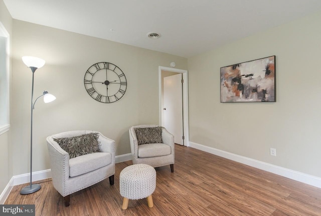 sitting room featuring hardwood / wood-style flooring