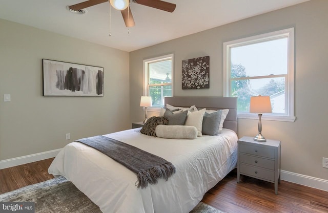 bedroom featuring dark hardwood / wood-style floors and ceiling fan