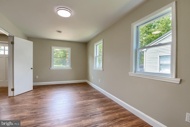 spare room featuring hardwood / wood-style floors