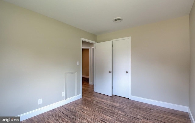 unfurnished bedroom with wood-type flooring