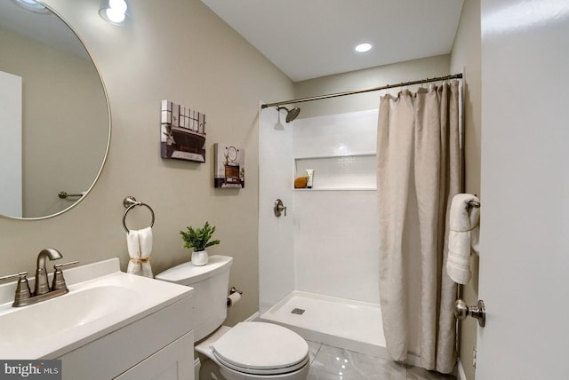 bathroom with tile patterned flooring, a shower with curtain, toilet, and vanity