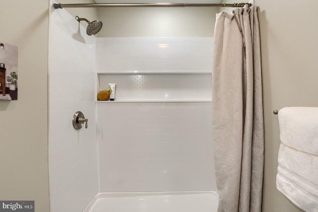 bathroom with shower / bathtub combination with curtain